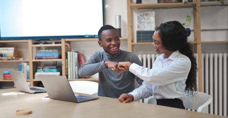 young couple works in an office